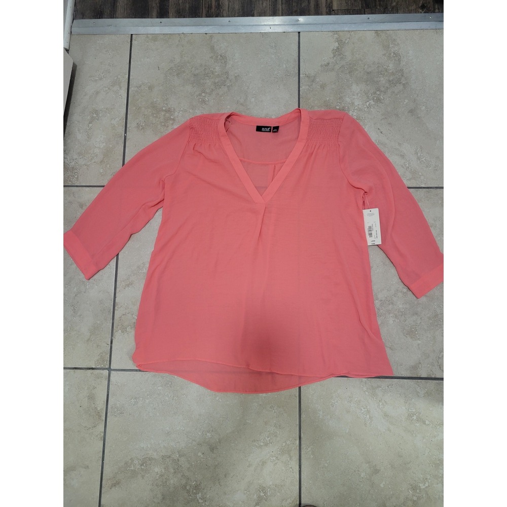 Salmon colored‎ semi sheer blouse
